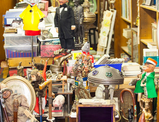 Old vintage objects and furniture for sale at a flea market