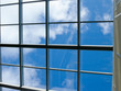 © evgenfagot - Blue sky with white clouds through the window in the ceiling of a large building