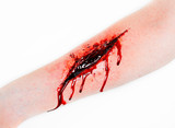 Fototapeta Storczyk -  cut wound blood on hand cut sutsyd vein professional makeup flows blood