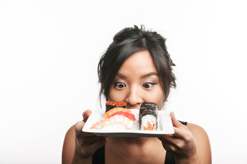 Poster - Beautiful young asian woman holding plate with sushi set