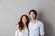 Cheerful asian couple standing