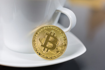 Bitcoin cryptocurrency coin as payment or exchange for coffee