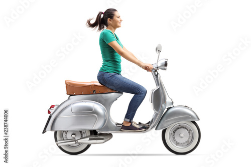 girl riding vespa scooter