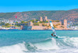 Saint Peter Castle (Bodrum castle) and marina in Bodrum, Turkey - Beautiful cloudy sky with Windsurfer Surfing The Wind On Waves