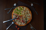 Fototapeta Natura - Delicious italian pizza served on wooden table. Flat lay