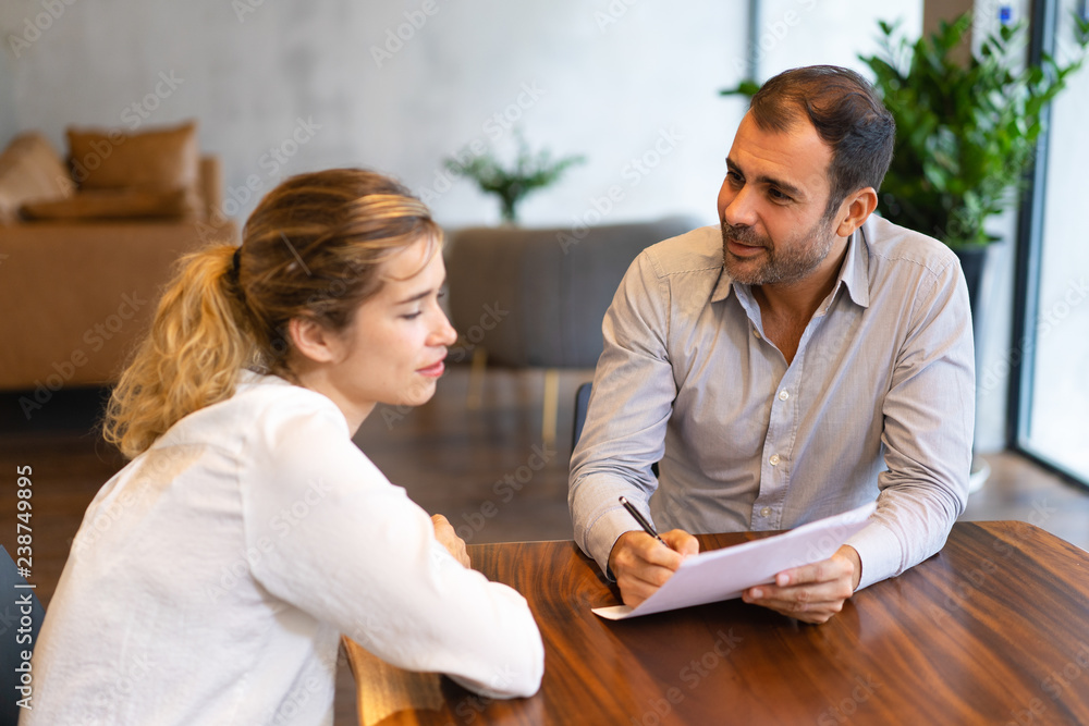 Positive manager explaining project details to team member. Two ...