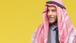 Young handsome arabian man with long hair wearing keffiyeh over isolated background smiling looking side and staring away thinking.