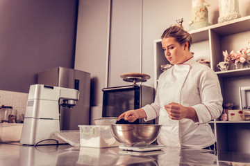 Nice skilled woman cooking in the kitchen