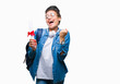 © Krakenimages.com - Young braided hair african american student girl holding degree over isolated background screaming proud and celebrating victory and success very excited, cheering emotion
