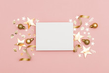 Gold Christmas Cracker With A Blank White Label. Luxury Gold Festive Cracker On A Pastel Pink Background
