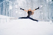 Girl gymnast, performs various gymnastic and fitness exercises. A healthy lifestyle. Winter