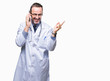 © Krakenimages.com - Middle age senior hoary doctor man talking on smartphone over isolated background very happy pointing with hand and finger to the side