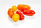 Fototapeta Kuchnia - Multicolored cherry tomatoes isolated on white reflective background