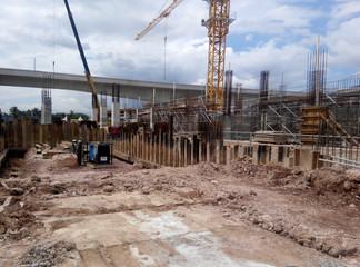 View of construction site during foundation work stage. Some of the places, the earthwork is still in progress. 