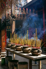 The smoke of the incense sticks fills the air with an intensive smell at the Thien Hau temple in Ho Chi Minh City, Vietnam