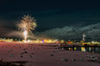 New years fireworks over town of Hauganes, Iceland
