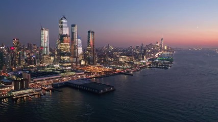 Wall Mural - Aerial drone footage of New York skyline at dusk with camera rotation in front of midtown Manhattan skyscrapers