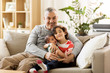 © Syda Productions - family, fatherhood and people concept - happy father with preteen and baby son at home