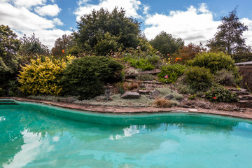 Wall Mural - Home pool in the garden on a summery day