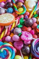 Wall Mural - different colors of candy, lollipops, chewing gum and other sweets. The background is sweet