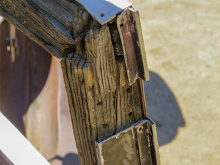 Desert grunge closeup of old decayed wooden car part