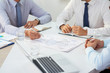 © DragonImages - Team of business people diacussing ideas of company development at meeting