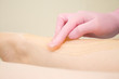 © FOTO_STOCKER - procedure of hair removing on leg beautiful woman with sugar paste or wax honey and pink gloves hand - depilation and beauty concept