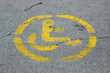 © robot recorder - Disabled persons no parking sign yellow on grey asphalt