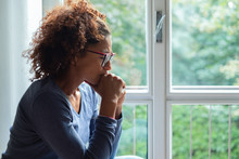 Lonely Black Woman Near Window Thinking About Something