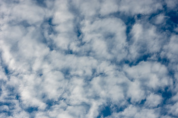 The beauty of the sky with clouds and the sun.