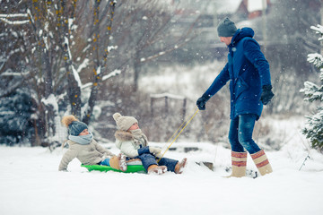 Family of dad and kids vacation on Christmas eve outdoors