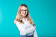 © Elizaveta - Blank for advertising. Portrait young caucasian woman worker teacher coach mentor in white shirt office style business lady leader advertising glasses eyesight blue isolated color background