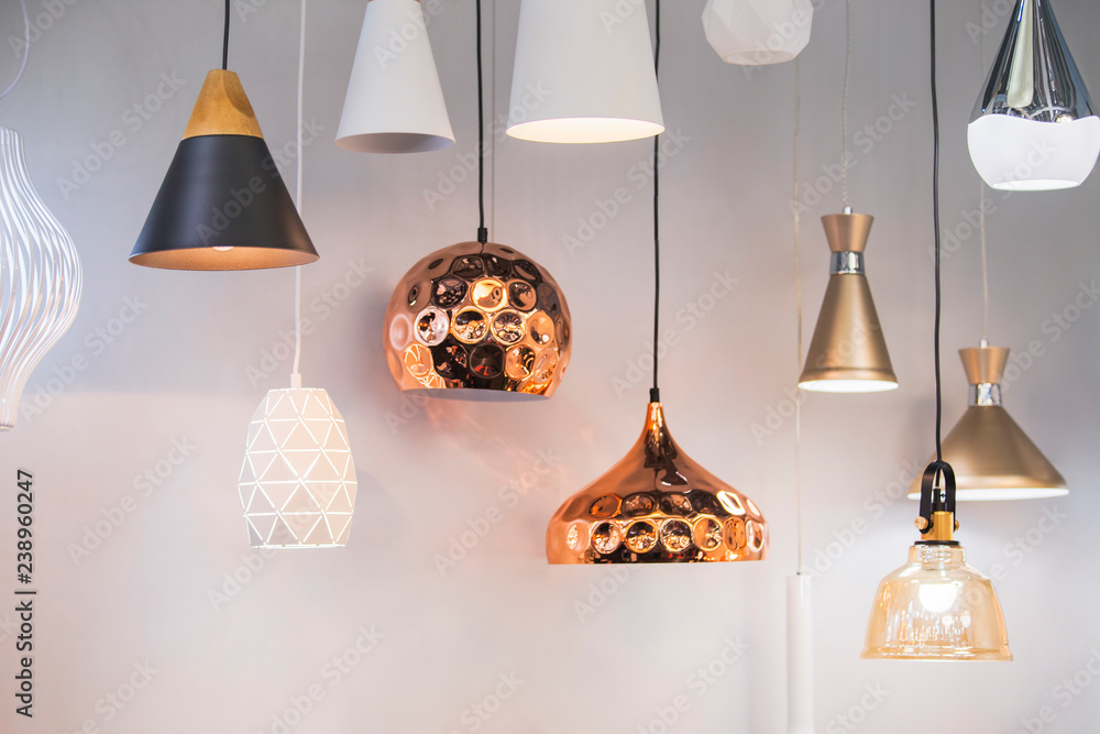 Different modern streamlined mirror copper chandeliers. Bubble metal copper shade pendant - obrazy, fototapety, plakaty 
