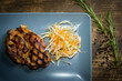 © Bogdan - Pork steak on plate, top view