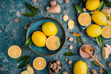 Wall Mural - Ingredients for cold tea: lemon, ginger and honey. Food and drink, healthcare concept. Colorful still life