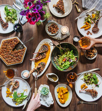Modern Spring Tablescape With Lamb, Spring Salad, Golden Beets, Mixed Drinks, And Pecan Pie