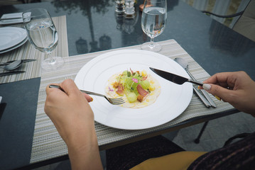 point of view food in plate with fork and knife