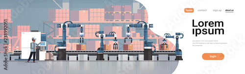 Fotografía man engineer controlling conveyor belt line robotic hands factory automation pro