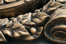 Laurel Wreath  Close-up Dark Bronze Metal Cast Background. Vintage Leaves And Berries Sculpture Art Detail