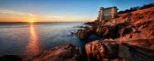 Boccale Castle On Rocky Coastline Near Livorno At Sunset, Italy 