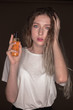 © Sunrise Team - The portrait of a young girl with blonde hair isolated on a brown background