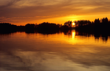 Wall Mural - sunset over lake in eastern finland