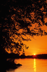 Wall Mural - sunset over lake in eastern finland