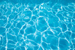 © Q - background blue transparent water of swimming pool, vibrating with ripples