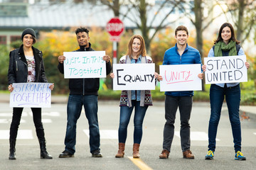 Group of protesters holding a sign 