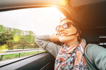 Woman Enjoy With View From Car Window When Traveling By Auto