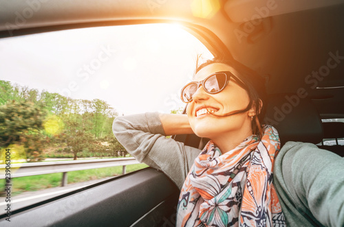 Woman enjoy with view from car window when traveling by auto Tableau sur Toile
