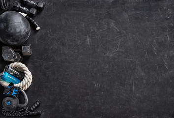 Sports equipment on a black background. Top view. Motivation