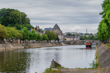 Wall Mural - Banks of the Mayenne river, City of Laval, Mayenne, Pays de Loire, France. August 5, 2018