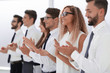 © ASDF - group of business people applauding standing